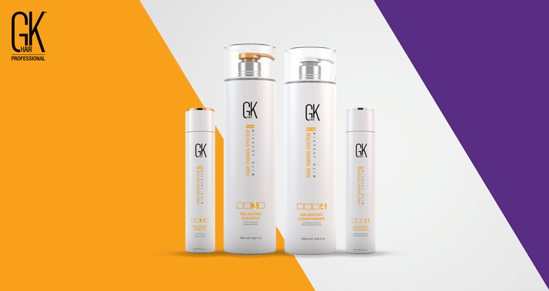 GK Hair balancing shampoo and conditioner bottles standing side by side