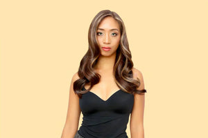 A Lady Slaying her Dark Blonde Hair