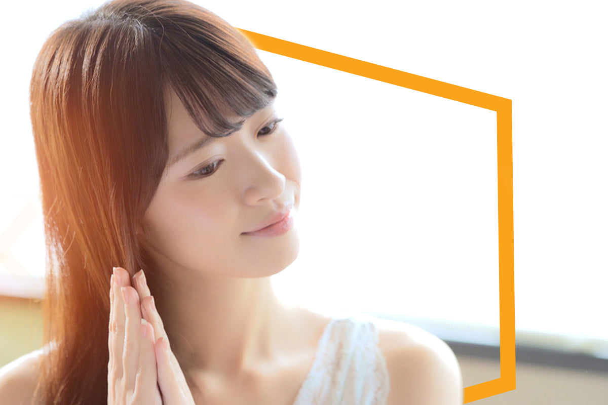 Woman with a short bob styled sleek and straight, falling just below the jaw