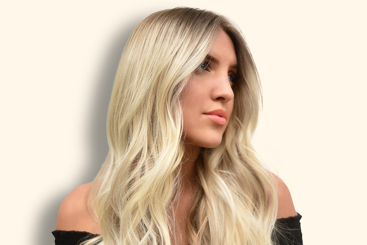 Woman with hair pulled into a simple braided updo suited to humid weather