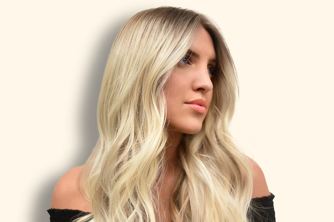 Woman with hair pulled into a simple braided updo suited to humid weather