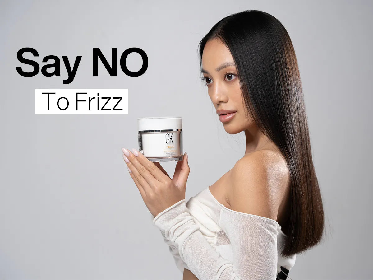 A lady with no frizz in her hair holding GK Hair cream