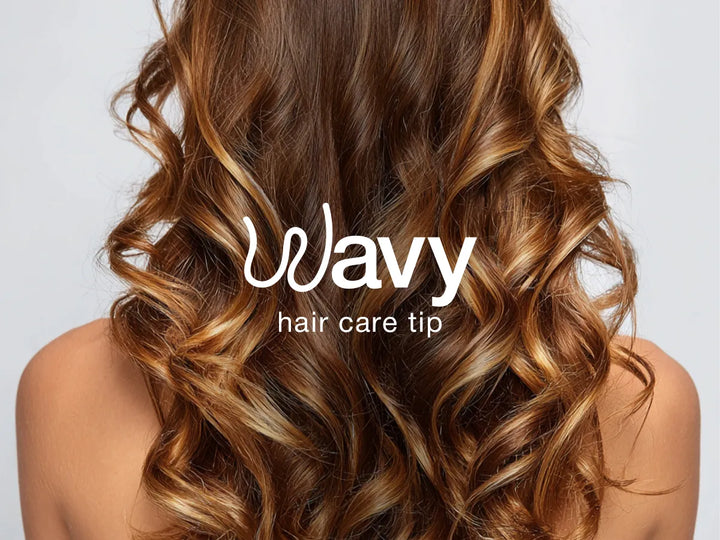 Back view of wavy, highlighted hair with the text "Wavy hair care tip" centered in white.