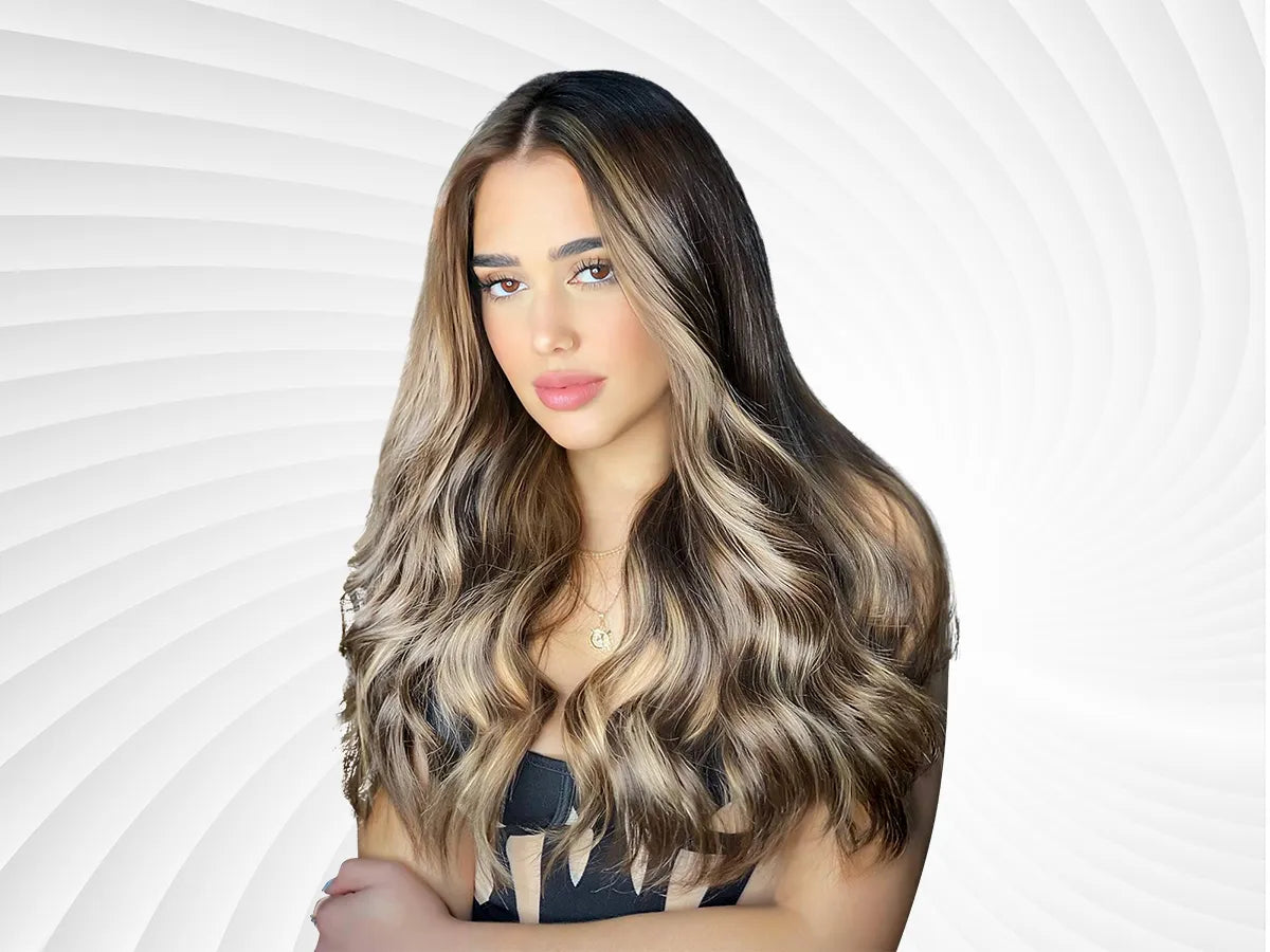 Brown hair with blonde highlights and lowlights blended through mid-lengths and ends