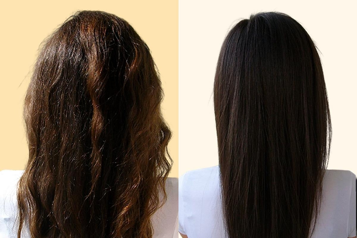 Woman applying conditioner to damp hair as part of a daily hair care routine