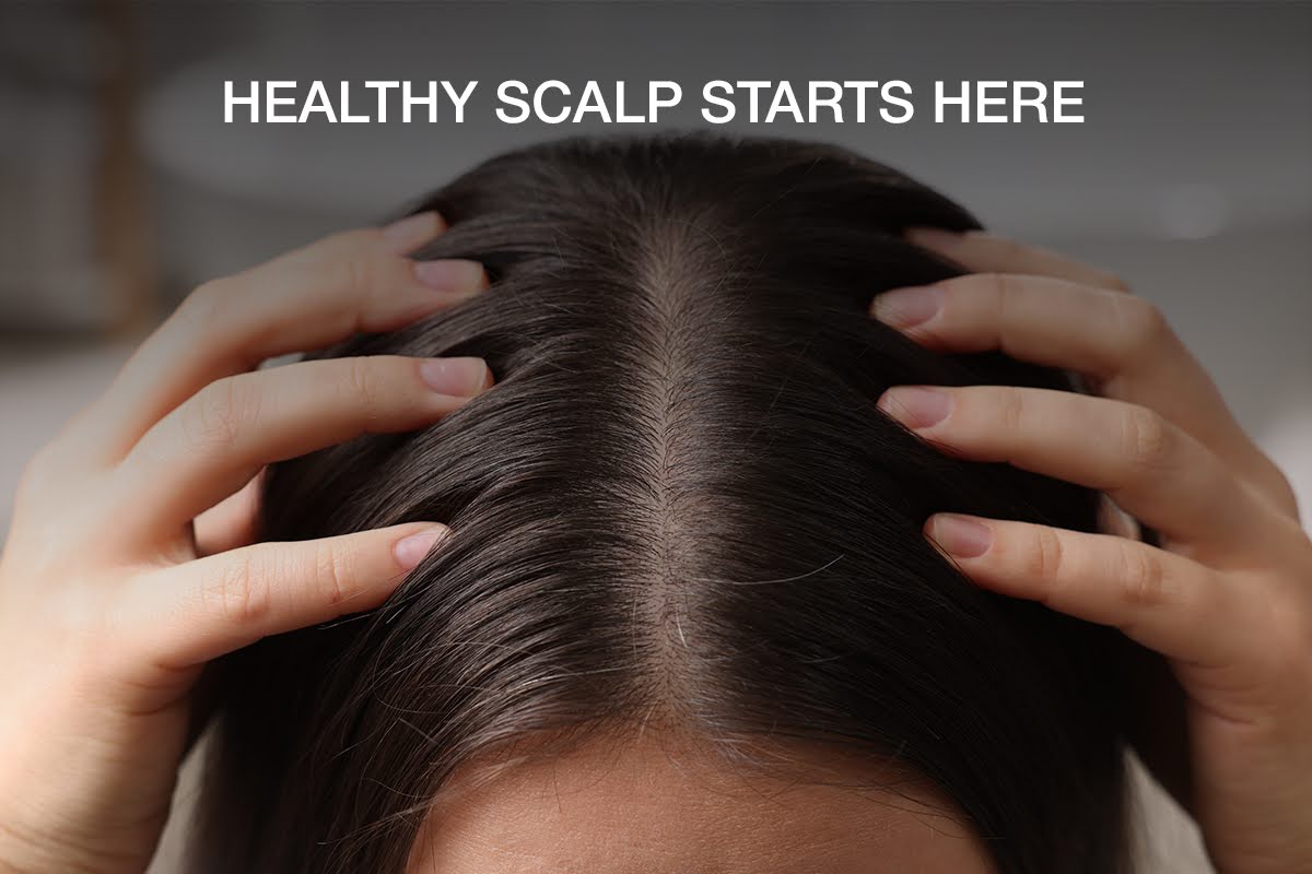 Leave-in scalp treatment applied directly to the roots along a section of parted hair