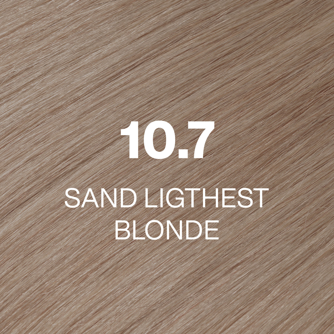 GK Hair Juvexin Cream Color 10.7 Sand Lightest Blonde swatch: sandy beige blonde hair texture, shade name in white