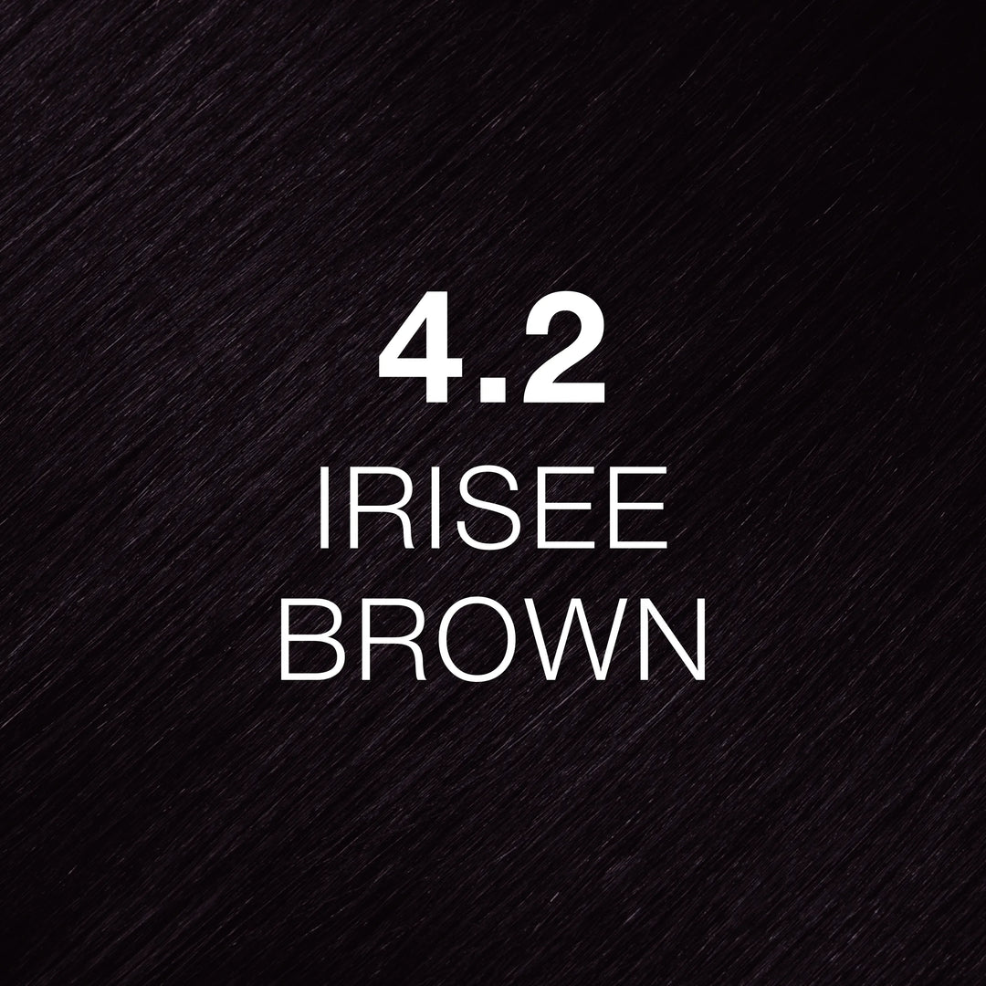 Very dark violet-toned brown hair texture printed with 4.2 Irisee Brown in white, a GK Hair Juvexin Cream Color swatch