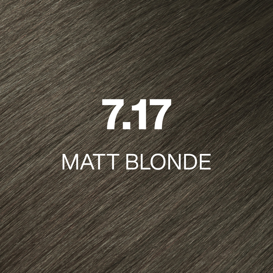 GK Hair Juvexin Cream Color 7.17 Matt Blonde swatch: cool olive-gray brown hair with the code and name in white text