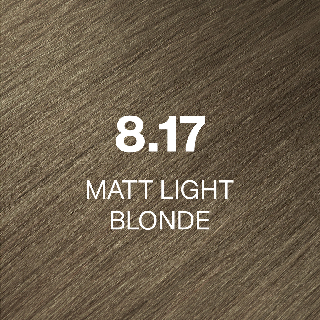 GK Hair Juvexin Cream Color 8.17 Matt Light Blonde hair color swatch: muted olive-beige strands labeled in white