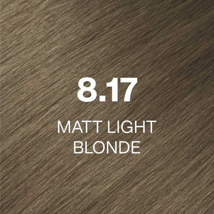 GK Hair Juvexin Cream Color 8.17 Matt Light Blonde hair color swatch: muted olive-beige strands labeled in white
