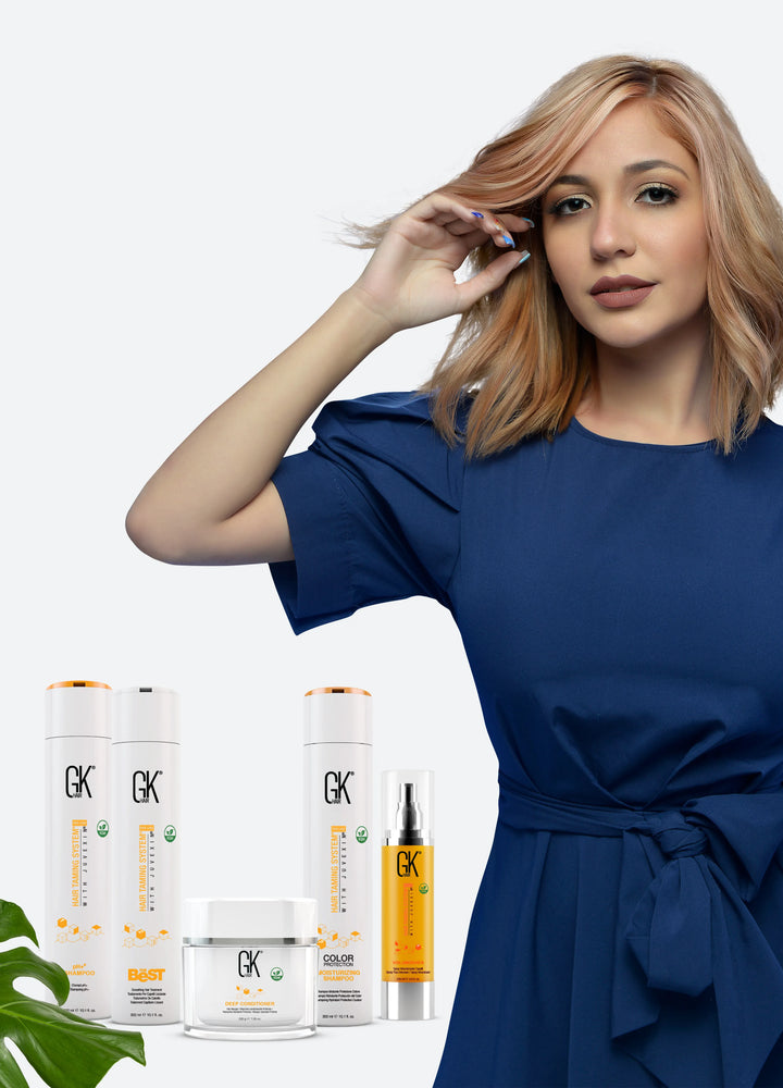 A lady with gorgeous fluffy hair and GK Hair products