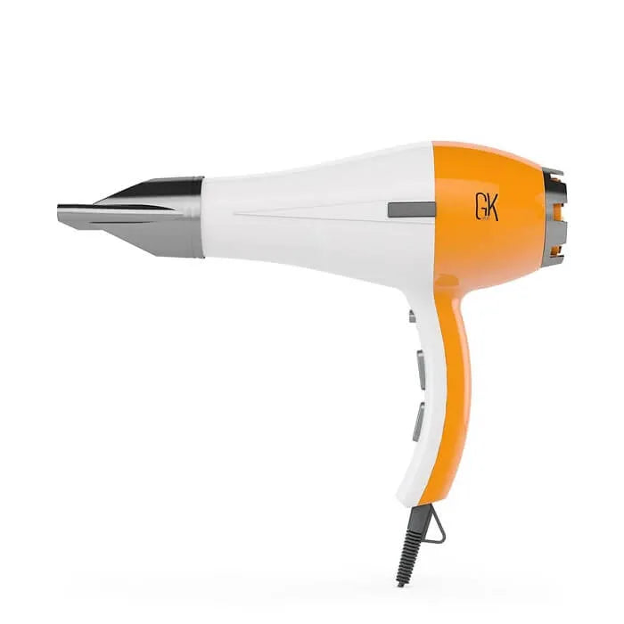 White and orange GK blow dryer in flat side profile with a silver nozzle and gray switches, on a white background
