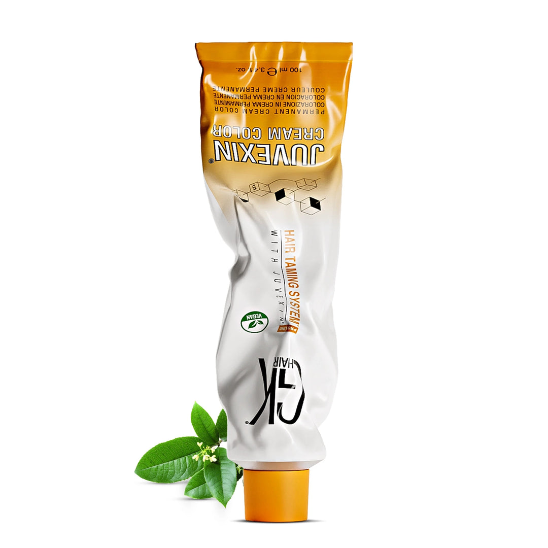 GK Hair Juvexin Cream Color 100 ml / 3.4 fl. oz. tube with a vegan leaf badge, resting on its orange cap on white