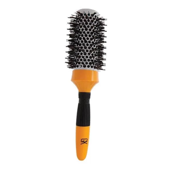 GK Hair Extra Round Hair Brush Pro standing upright, orange vented barrel with black bristles and a GK logo on the handle, on white