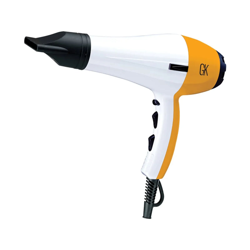 White and orange GK blow dryer with a black concentrator nozzle and coiled cord, angled view on a white background