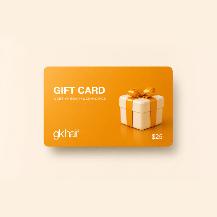 Orange gift card with a decorative box and bow, featuring the &