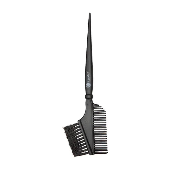 Black GK Hair application brush with a comb on the reverse side and a long pointed tail handle, on white