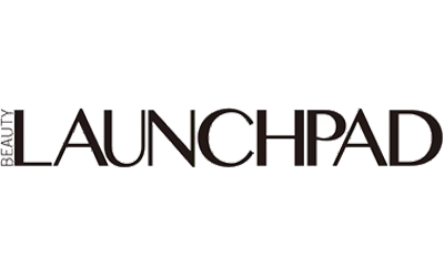 Wide Beauty Launchpad magazine logo, BEAUTY stacked sideways to the left of LAUNCHPAD in black serif capitals