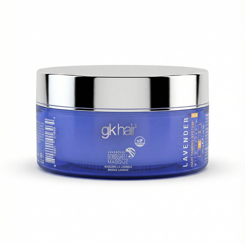 Blue jar with silver lid labeled 'gk hair' on a white background