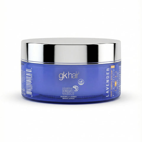 Blue jar with silver lid labeled 'gk hair' on a white background