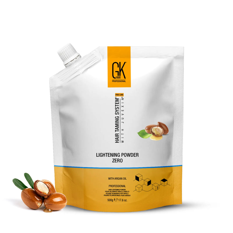 GK Hair Lightening Powder Zero with Argan Oil 500 g white and yellow pouch beside argan nuts on a white background