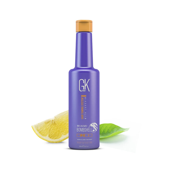 GK Hair Miami Bombshell Taming Blonde Treatment 280 ml violet bottle with a lemon slice and green leaf beside it