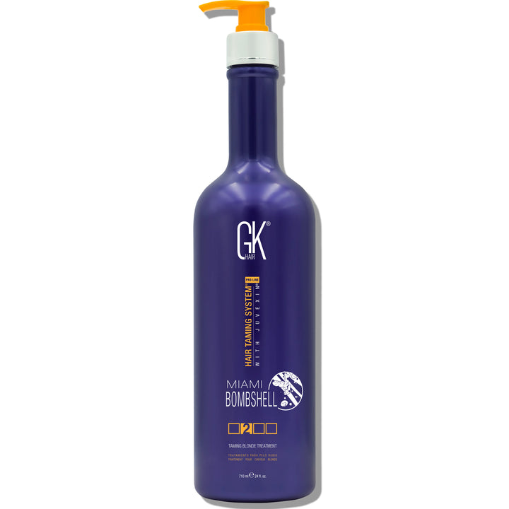 Purple bottle of GK Hair Miami Bombshell 710ml Shampoo with a pump dispenser, featuring a sleek design and branding details.