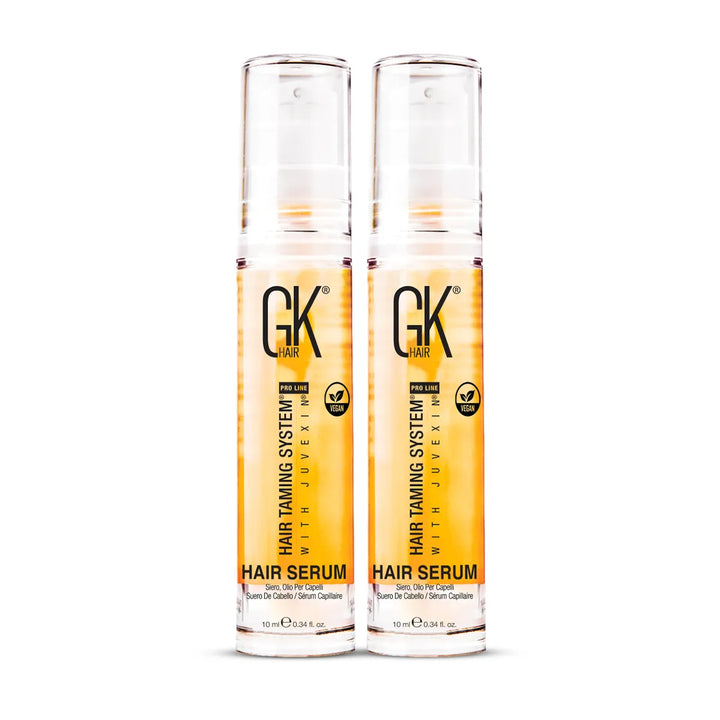 Two GK Hair Hair Serum 10 ml pump bottles side by side, Hair Taming System with Juvexin, Pro Line and Vegan badges