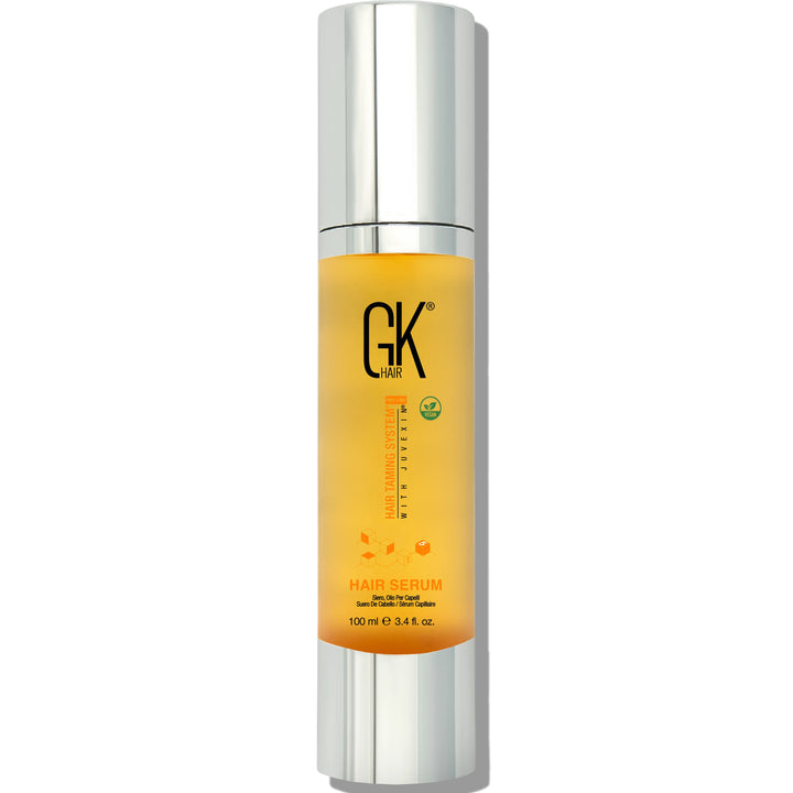 GK Hair Hair Serum 100 ml in a tall silver pump bottle of amber serum with a green vegan badge, front view on white