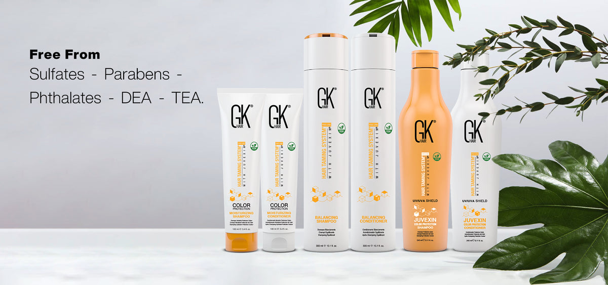 Free From Sulfates - Parabens - Phthalates - DEA - TEA banner with six GK Hair shampoo and conditioner packs and foliage