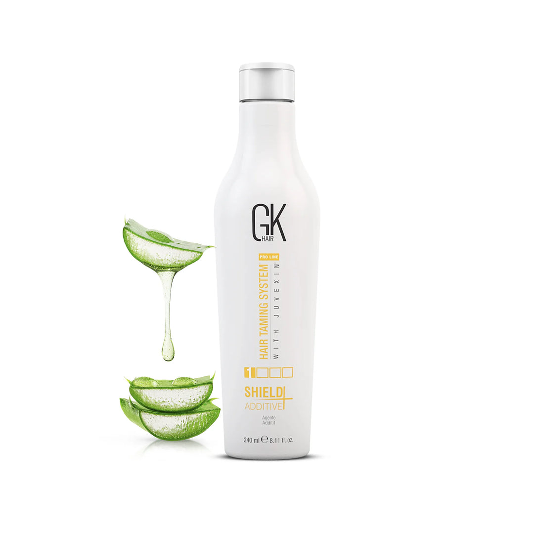 GK Hair Shield Additive 240 ml white bottle with a silver cap, aloe vera slices and dripping gel beside it