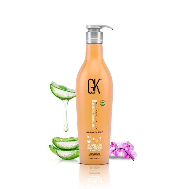 GK Hair UV/UVA Shield Juvexin Color Protection Shampoo 650 ml orange bottle with a silver pump, aloe vera slices and a pink orchid