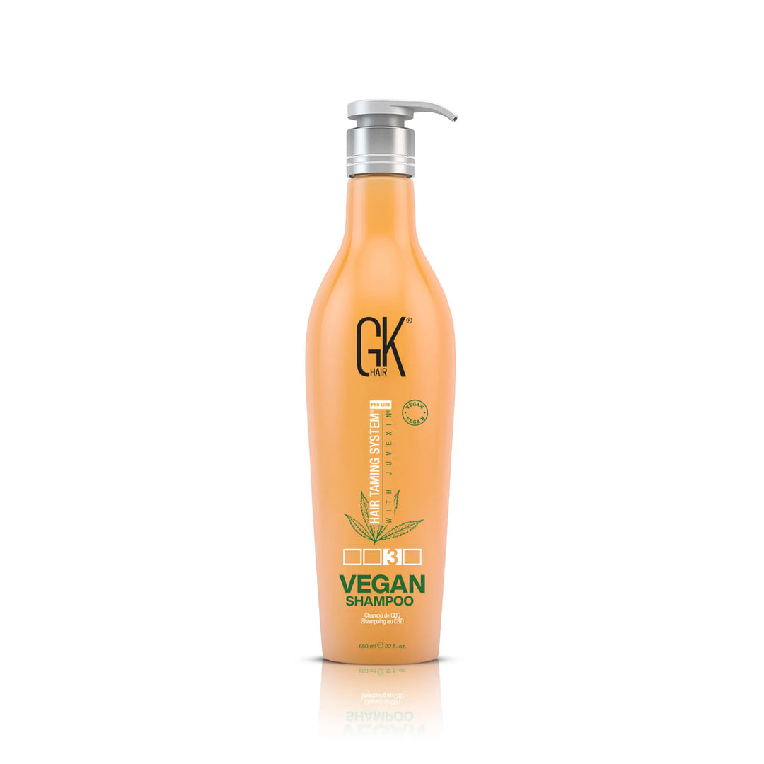 GK Hair Vegan Shampoo 650 ml peach pump bottle, front view of the green VEGAN SHAMPOO label on white