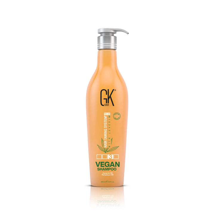 GK Hair Vegan Shampoo 650 ml peach pump bottle, front view of the green VEGAN SHAMPOO label on white