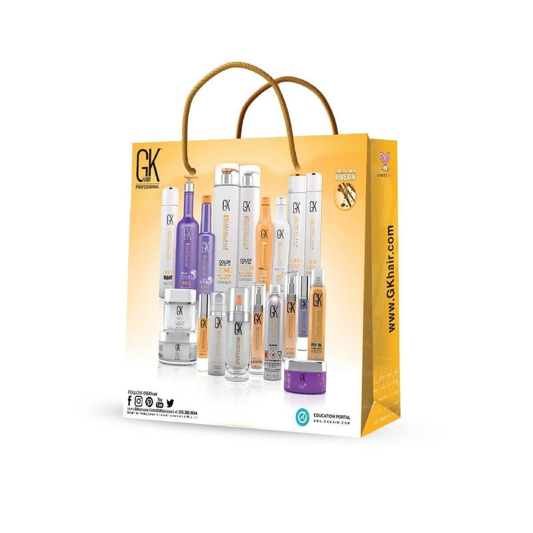 Gold GK Hair Professional paper shopping bag with rope handles, printed with a lineup of GK Hair bottles and jars