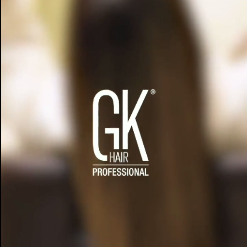 Gold GK Hair Serum pumped into a palm, then smoothed through long straight caramel hair; text: Get Flawless Beautiful Hair